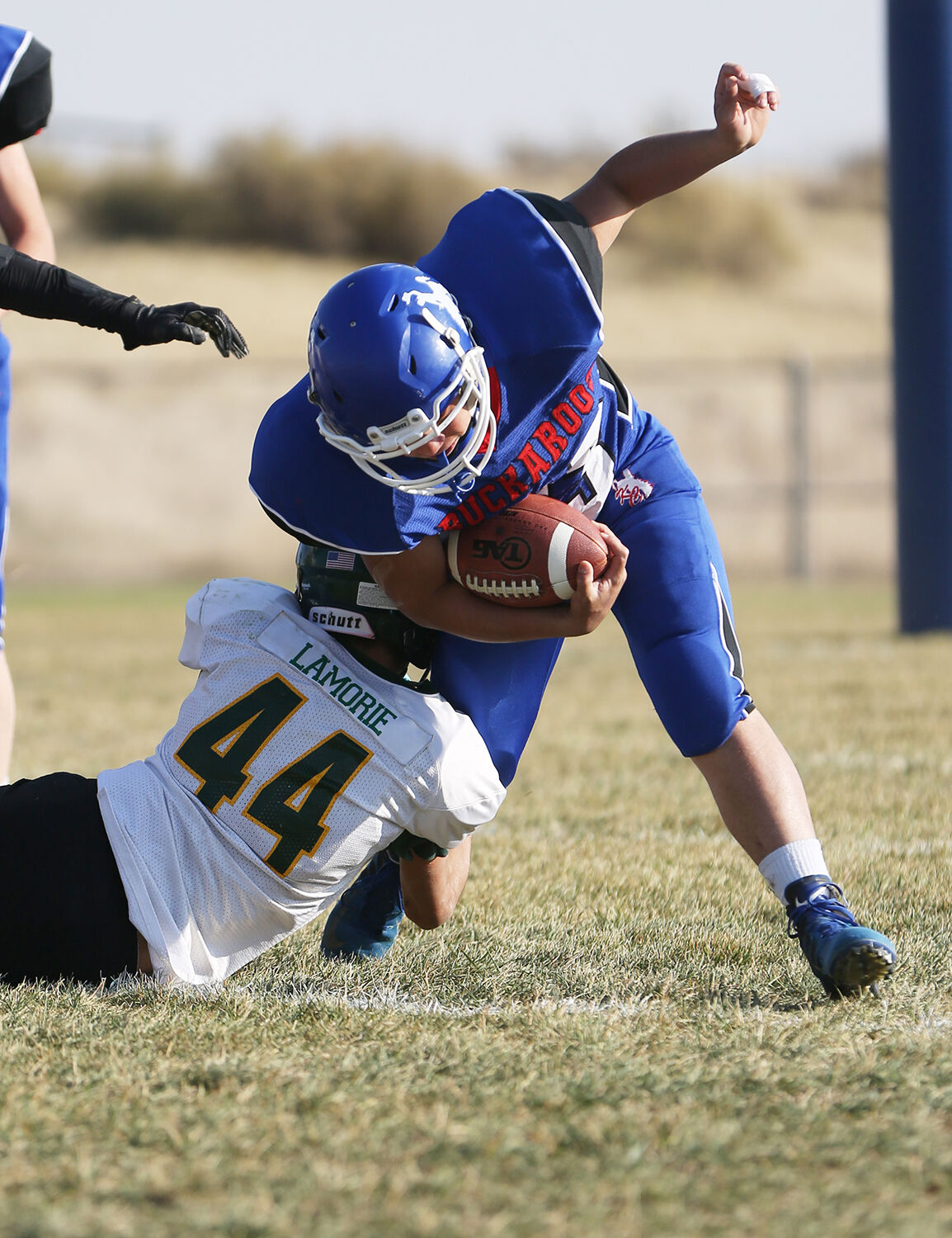 Ruben Cleveland attempts to pull his way out of a tackle by Triston Lamorie